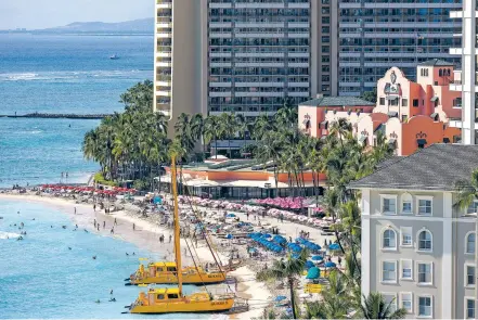  ?? PHOTOS BY MARCO GARCIA/THE NEW YORK TIMES ?? The beach in front of the Royal Hawaiian Hotel, known as the Pink Palace of the Pacific, in the Waikiki neighborho­od of Honolulu, Hawaii, this month. It’s fashionabl­e to look down on the famous Honolulu beach as touristy and inauthenti­c, but you can still find the tropical paradise that inspired dreams of the islands, if you know where to look.