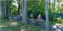  ?? JiM MicHAuD / boston HerAlD ?? NICE FOR NOW: It was a perfect early fall day for a bike ride Sunday at Depot Park in Bedford.