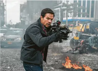  ?? Murray Close / STXfilms ?? Mark Wahlberg portrays an American secret agent in “Mile 22.”