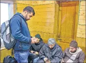  ?? PTI ?? ■
People use their cellphones after the government orders restoratio­n of prepaid mobile services and 2G internet services in two districts of the Kashmir Valley, in Srinagar on Saturday.