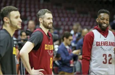  ?? JOSHUA GUNTER — THE PLAIN DEALER VIA AP ?? (From left) Cleveland Cavaliers forward Larry Nance Jr., center Kevin Love and forward Jeff Green cool down after practice Tuesday at Quicken Loans Arena in Cleveland, Ohio.