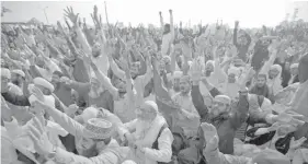  ?? ASSOCIATED PRESS ?? Supporters of Pakistani radical religious party Tehreek-i-Labaik Ya Rasool Allah shout slogans during a sit-in protest in Islamabad, Pakistan. Hundreds of Islamists have camped out on the edge of Pakistan's capital to demand the removal of the country's law minister.