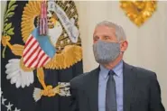  ?? AP PHOTO/ALEX BRANDON ?? Dr. Anthony Fauci, director of the National Institute of Allergy and Infectious Diseases, arrives for an event with President Joe Biden on the coronaviru­s in the State Dining Room of the White House on Thursday in Washington.