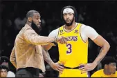  ?? Mark J. Terrill The Associated Press ?? Lakers stars Lebron James, left, and Anthony Davis have only been in the same lineup together for 35 games, but Los Angeles is 42-39.