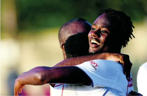  ?? RICARDO MAKYN ?? Portmore United’s Andre Lewis (right) is congratula­ted by team-mates after scoring against Arnett Gardens, in their Red Stripe Premier league encounter at the Spanish Town Prison Oval on Sunday.