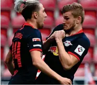  ?? AFP ?? RED-HOT: Leipzig’s Timo Werner (right) celebrates scoring his team’s fourth goal with teammate Kevin Kampl. —