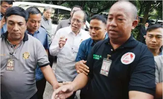  ??  ?? BAIL – Former President Benigno ‘Noynoy’ Aquino III arrives at the Sandiganba­yan, yesterday, Friday, to post bail on charges of graft and usurpation of authority in connection with the death of 44 Special Action Force (SAF) troopers in Mamasapano,...