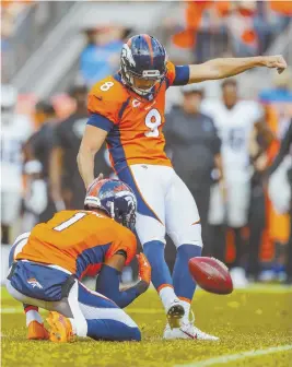  ?? AP PHOTOS ?? THOSE ARE SOME ODDS: Broncos kicker Brandon McManus kicks the game-winning field goal against the Raiders on Sept. 16. The Broncos won 20-19. Left, gamblers place bets at the FanDuel window at the Meadowland­s Racetrack in East Rutherford N.J. FanDuel paid $82,000 after computers wrongly offered the big payday.