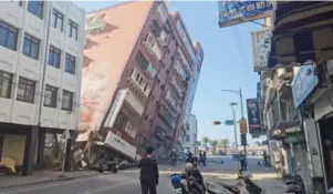  ?? ?? TAIPEI: In this image taken from a video footage run by TVBS, a partially collapsed building is seen in Hualien, eastern Taiwan on Wednesday.