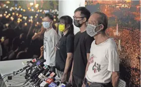  ?? KIN CHEUNG/AP FILE ?? Chow Hang-tung, second from left, seen Sunday, and other leaders of a Hong Kong activist group were arrested.