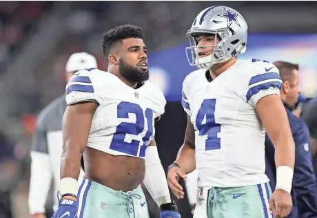  ?? MATTHEW EMMONS / USA TODAY SPORTS ?? Dallas Cowboys running back Ezekiel Elliott (left) and quarterbac­k Dak Prescott pose a formidable challenge to the Green Bay Packers defense.