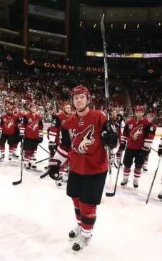  ?? NORM HALL/GETTY IMAGES ?? Shane Doan acknowledg­es the fans after his last home game as an Arizona Coyote on April 8. Doan is retiring after 21 seasons in the NHL.