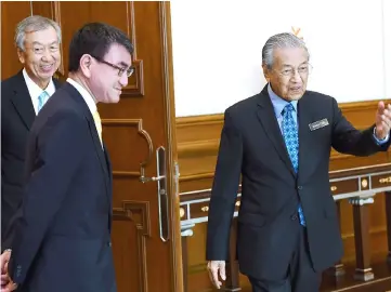  ??  ?? Dr M (right) together with Kono during his visit at Wisma Putra. Also seen is Japan’s ambassador Dr Makio Miyagawa (left). — Bernama photo