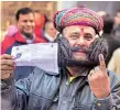  ?? PHOTO : PTI ?? Girdhar Vyas, who claims to sport the longest moustache in the world, after casting his vote in Bikaner