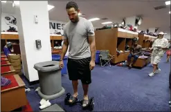  ??  ?? Tennessee Titans linebacker Derrick Morgan rides through the locker room on a motorized skateboard in Nashville, Tenn.