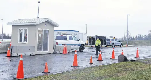  ?? ALISON JENKINS/LOCAL JOURNALISM INITIATIVE REPORTER ?? The Atlantic bubble has burst for the next two weeks, as travel between P.E.I. and the mainland is restricted to essential traffic only. Steve Cullen, Highway Safety officer at the Confederat­ion Bridge, said Monday was a busy day at the checkpoint as news of the changes to the bubble was made public.