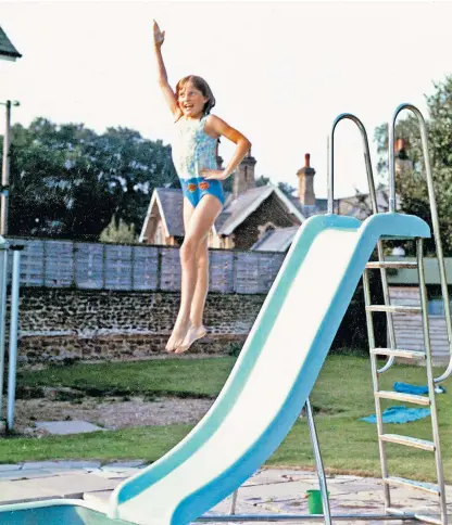  ??  ?? The young Diana jumps off ‘the chute’ – the slide that her father built next to the pool at Park House, Sandringha­m, far left