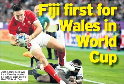  ??  ?? Josh Adams goes over for a Wales try against Fiji in their clash during the 2019 World Cup