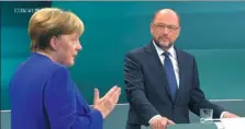  ?? RTL VIA ASSOCIATED PRESS ?? German Chancellor Angela Merkel (left) and her challenger Martin Schulz attend the only TV debate three weeks before the parliament elections in a TV studio in Berlin on Sunday.