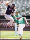  ??  ?? Cleveland Indians first baseman Bobby Bradley, (left), tags out Oakland Athletics’ Mark Canha at first base during the first inning of a baseball game on July 18, in Oakland, Calif. (AP)