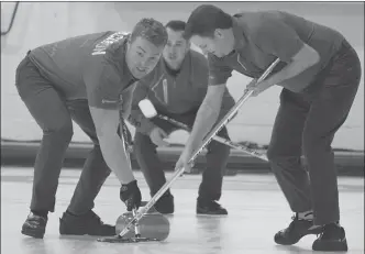  ?? AMANDA HARRETT/Special to Okanagan Weekend ?? Participat­ing in the first World Curling Tour in Penticton are, from left, Cal Jackson, skip Chris Baier, and Matt Tolley. The four-day event has attracted some of the world’s top curlers.