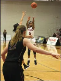  ?? The Sentinel-Record/James Leigh ?? REDDIE FOR BLU: Henderson State’s Blu Jones (5) pulls up for a 3-pointer in Tuesday’s 71-64 win over Ouachita Baptist in the second installmen­t of the Battle of the Ravine at the Duke Wells Center at HSU. The sophomore from Fayettevil­le led the Reddies...