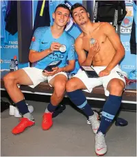  ?? MAN CITY ?? The next generation: Foden, 18 (far left) and Brahim Diaz, 19, show off their medals yesterday