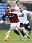  ??  ?? BATTLE: Barry Bannan and Biram Kayal go for the ball