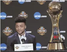  ?? AP PHOTO ?? HE’S THE MAN: Kansas’ Frank Mason III sits next to the Associated Press Player of the Year trophy he was awarded last night in Glendale, Ariz.