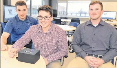  ?? TERRENCE MCEACHERN/THE GUARDIAN ?? UPEI engineerin­g students Mason Boertien, left, Bryce Stewart and Robert Smith have designed and developed a prototype of a THC breathalyz­er.