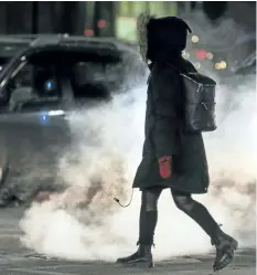  ?? ERNEST DOROSZUK/ POSTMEDIA NETWORK ?? Vapour rises along King St. W in downtown Toronto earlier in December. Environmen­t Canada issued cold warnings across the county on Tuesday.