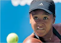  ?? AP ?? Naomi Osaka plays a return to Lesia Tsurenko. —