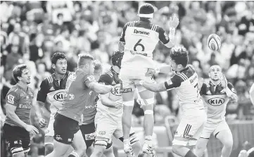  ??  ?? Vaea Fifita (centre) of the Hurricanes throws to TJ Perenara (right) of the Hurricanes from the linout during the Super Rugby semi-final match between Lions and Hurricanes at Ellis Park Rugby Stadium in Johannesbu­rg. — AFP photo