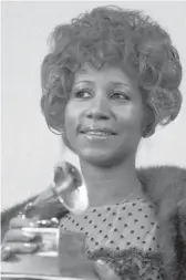  ?? DAVE PICKOFF/AP ?? Aretha Franklin on March 13, 1972, holds her Grammy Award for best rhythm and blues performanc­e for “Bridge Over Troubled Water.” A long-shelved documentar­y of her was filmed that year.