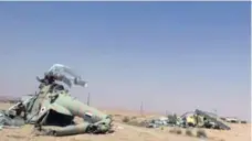  ?? THE ASSOCIATED PRESS ?? In a photo from an Islamic State website, damaged Syrian military helicopter­s are shown at the Palmyra air base captured by the militants.