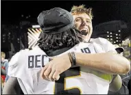  ?? AP/MARK HUMPHREY ?? Missouri quarterbac­k Drew Lock (right) hugs teammate Terry Beckner Jr. after Saturday’s victory over Vanderbilt. Lock leads the nation with 38 touchdown passes entering Friday’s game at Arkansas.