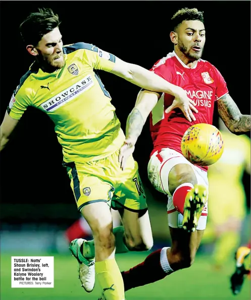  ?? PICTURES: Terry Parker ?? TUSSLE: Notts’ Shaun Brisley, left, and Swindon’s Kaiyne Woolery battle for the ball