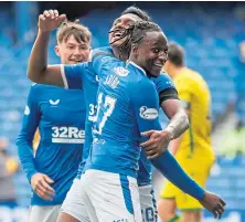  ??  ?? Joe Aribo celebrates his goal with Alfredo Morelos.