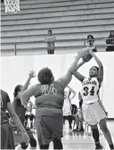  ?? Staff photo by Josh Richert ?? Arkansas High’s Ty Strickland goes up for a shot while being defended by El Dorado’s Kiearra Boone on Monday at Razorback Gym.