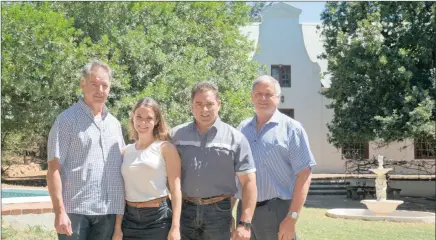  ??  ?? WINNING TEAM: Colin Green and Mariska Auret of the Rabie Property Group, with Berti Louw of AFM Family Trust and Alwyn Laubscher of Alwyn Laubscher & Associates, in front of the manor house at Clara Anna Fontein.