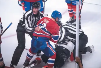  ?? CP PHOTO ?? Max Domi of the Montreal Canadiens is pulled away by linesman Ryan Daisy after sucker punching Florida Panthers defenceman Aaron Ekblad during an NHL preseason game on Wednesday night in Montreal.