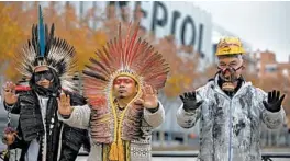  ?? PABLO BLAZQUEZ DOMINGUEZ/GETTY ?? Indigenous leaders from Brazil and an activist in Madrid protest oil pollution and the fossil fuel industry because of the damage it does to the poorest communitie­s in Brazil.