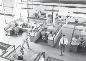  ?? GETTY IMAGES ?? Cubicle- based offices will have to be redesigned to reduce density.