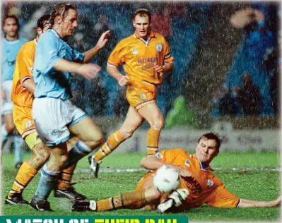  ?? MEN ?? Rearguard: Leicester’s Nicky Mohan slides in on City’s Paul Walsh, watched by Colin Hill