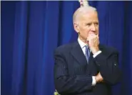  ??  ?? Vice President Joe Biden listens as President Barack Obama speaks before signing the 21st Century Cures Act into law in Washington on Dec. 13, 2016.