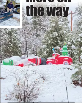  ?? Shelly Thorene /
Union Democrat ?? Quinten Clemens, 30, of Tuolumne (above left), checks the installati­on of a newly welded and repaired A frame on a Pinecrest Area Rentals Snow Removal service truck on Highway 108 in Mi-wuk Villagethu­rsday morning. A snowcovere­d Santa and Frosty the Snowman fell down on the job on Highway 108 in Sugarpine (above). Temperatur­es in the low 30s allowed newly fallen snow to melt on the roadway on Highway 108 in Mi-wuk Village Thursday (left).