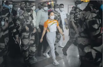  ?? AP ?? Weightlift­er Mirabai Chanu who won silver at the Tokyo Olympics arrives at the IGI airport on Monday.