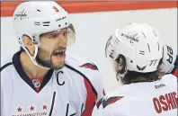  ?? AP PHOTO ?? Washington Capitals’ T.J. Oshie, right, celebrates his goal with Alex Ovechkin in the first period of Monday’s NHL playoff game in Pittsburgh.