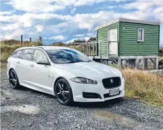  ??  ?? Jaguar XF Sportbrake: The company’s mid-sized executive sedan lends itself exceptiona­lly well to station wagon styling.