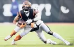  ?? EMILEE CHINN/AP ?? Bengals rookie wide receiver Ja’Marr Chase hauled in 81 receptions for 1,455 yards and 13 touchdowns in the regular season after reuniting with LSU teammate Joe Burrow.
